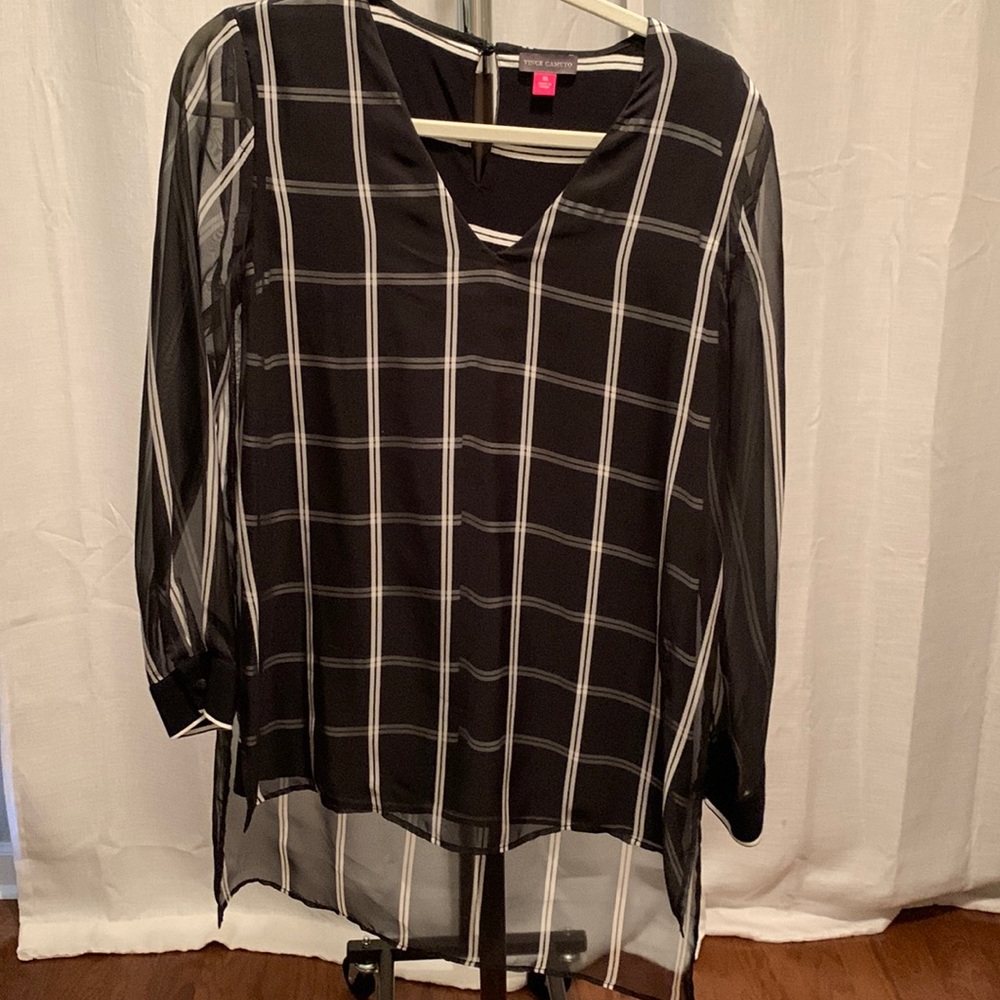 Lined, high/low detail.  Black window pane, sheer sleeves and overlay